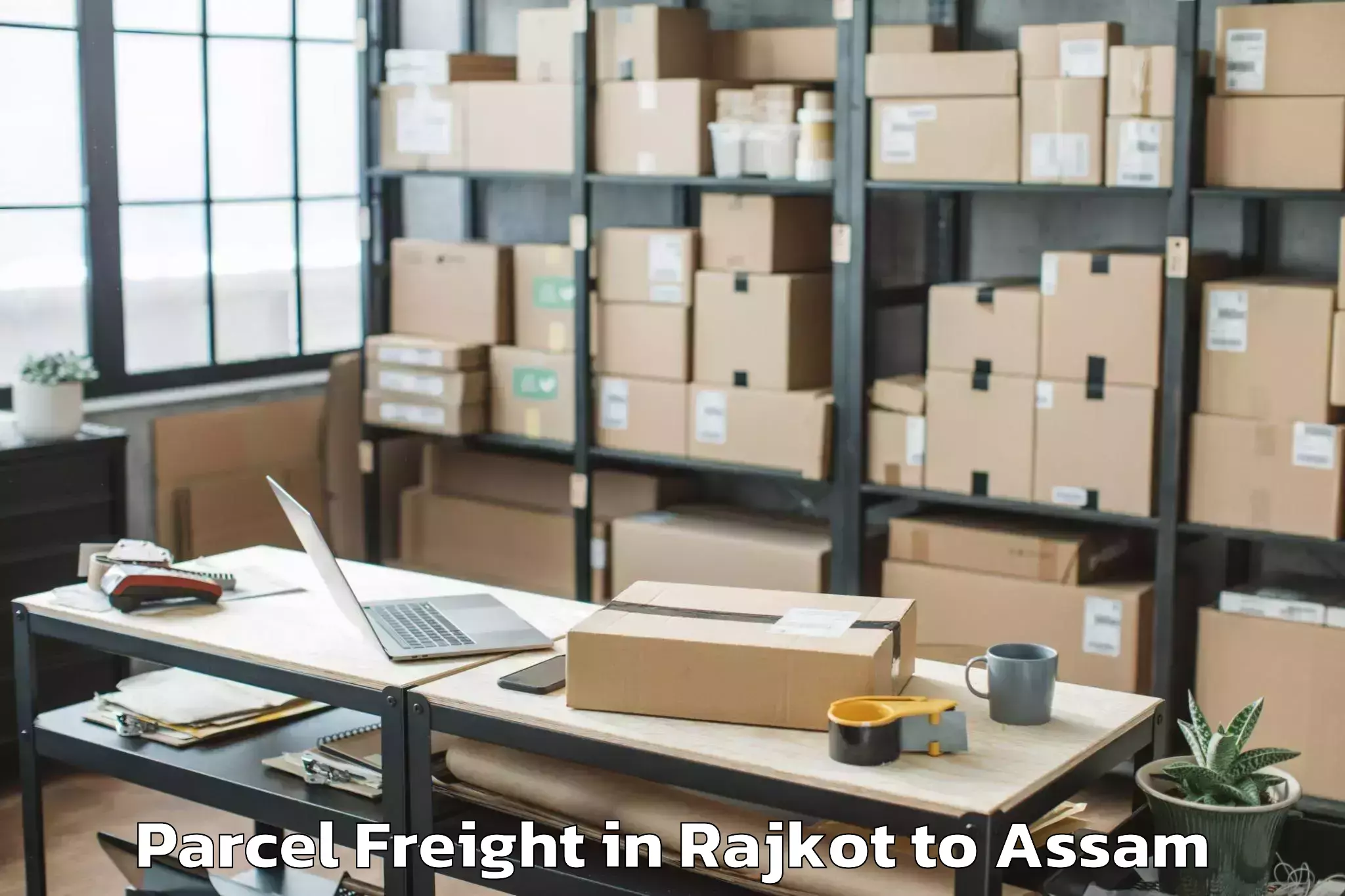 Quality Rajkot to Lumding Railway Colony Parcel Freight